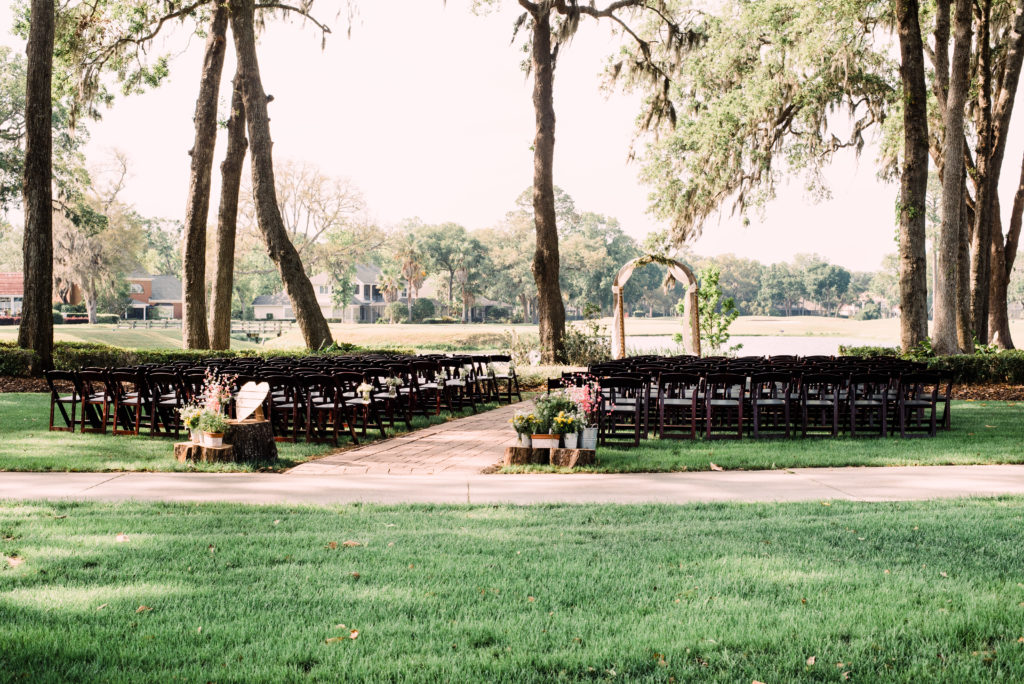 Queen's Harbour country club outdoor wedding ceremony site Jacksonville Florida Photography by Chabeli Woolsey Black Tie & Co www.btcweddings.com