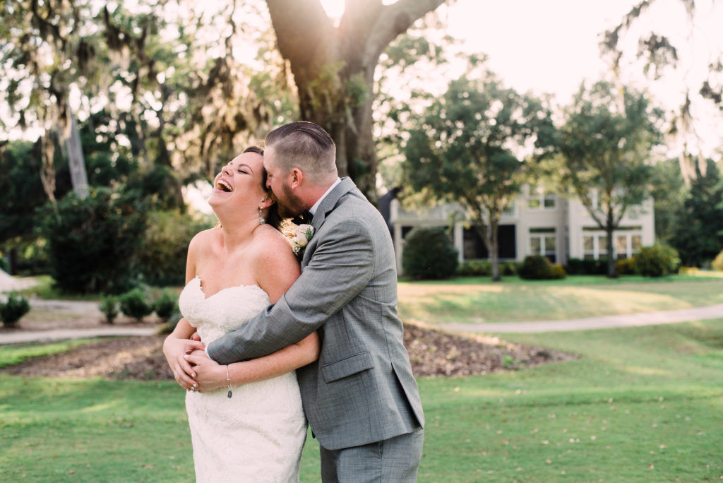 Bride and Groom laughing on the golf course at the Queen's Harbour country club in Jacksonville Florida Photography by Chabeli Woolsey Black Tie & Co www.btcweddings.com