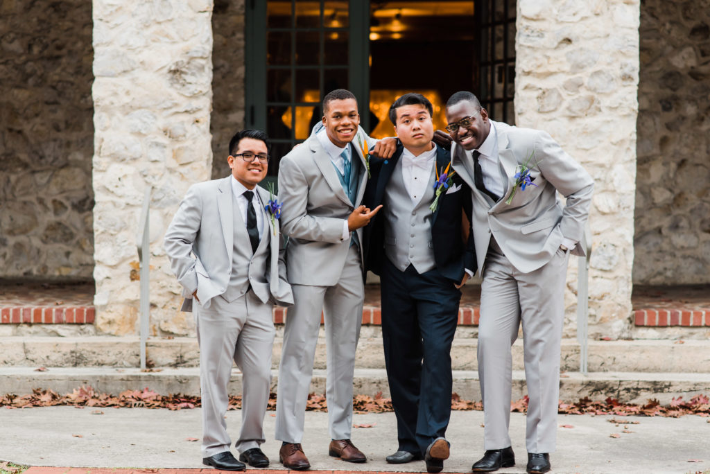 casual photo of groom and groomsmen outside of the Alachua Woman's Club in Florida 
Photo by: Black Tie & Co. (www.btcweddings.com)