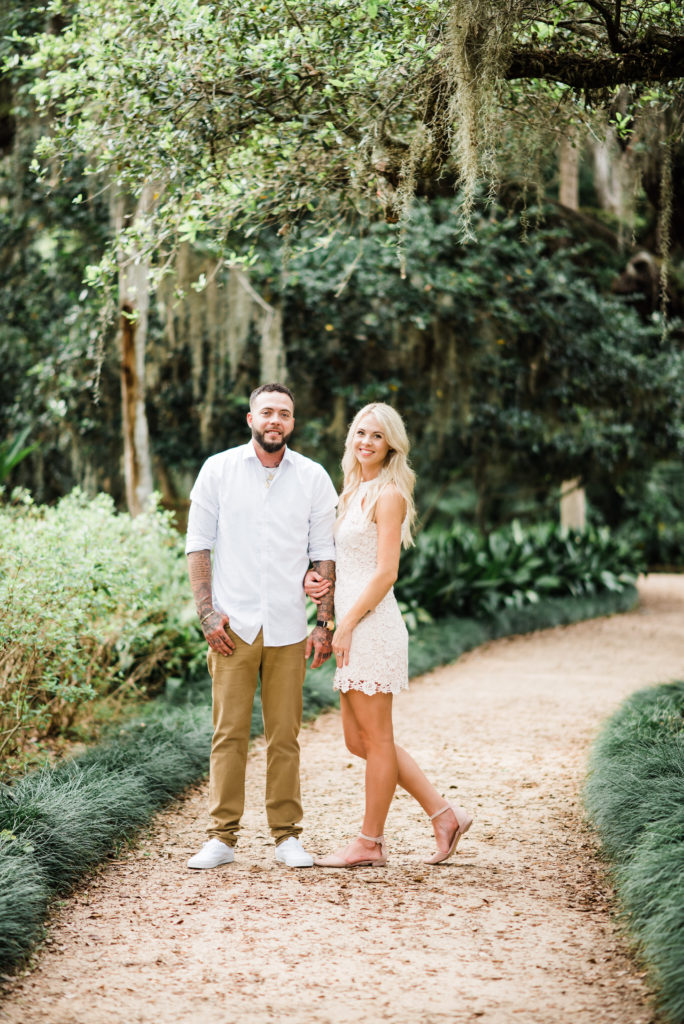 couple stands on pathway at the gardens at washington oaks state park.
photo by Chabeli Woolsey of Black Tie & Co www.btcweddings.com