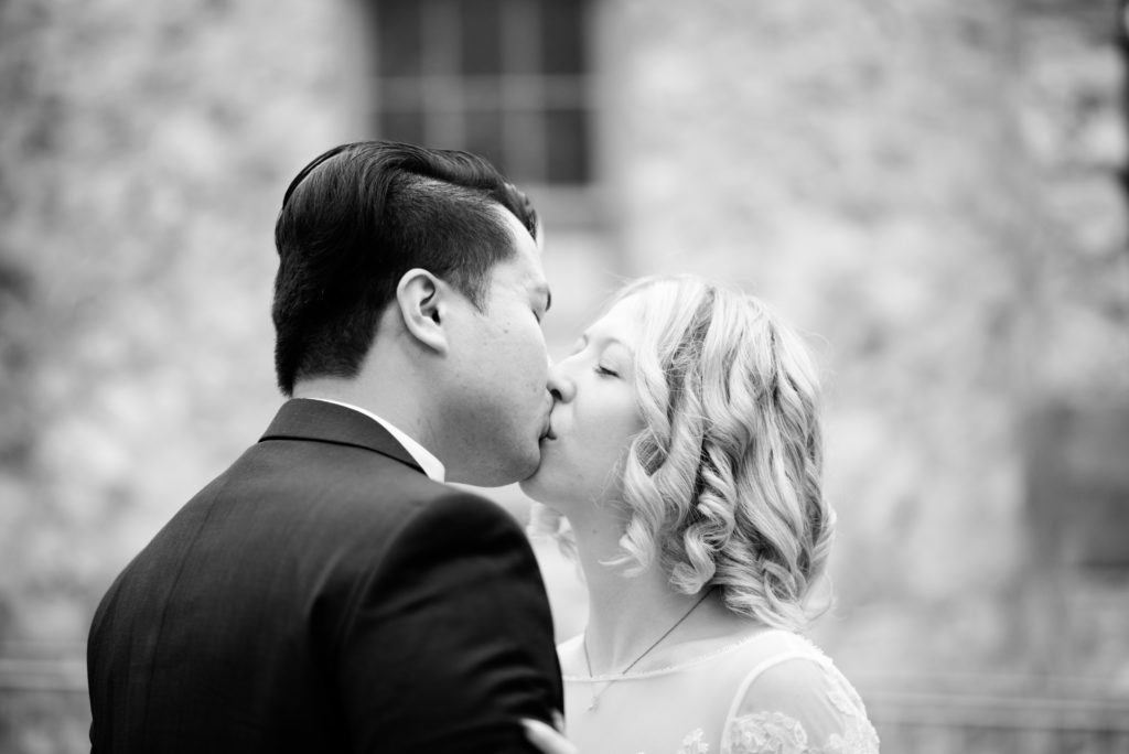 Bride and groom kiss outside of the Alachua Woman's Club in Florida 
Photo by: Black Tie & Co. (www.btcweddings.com)