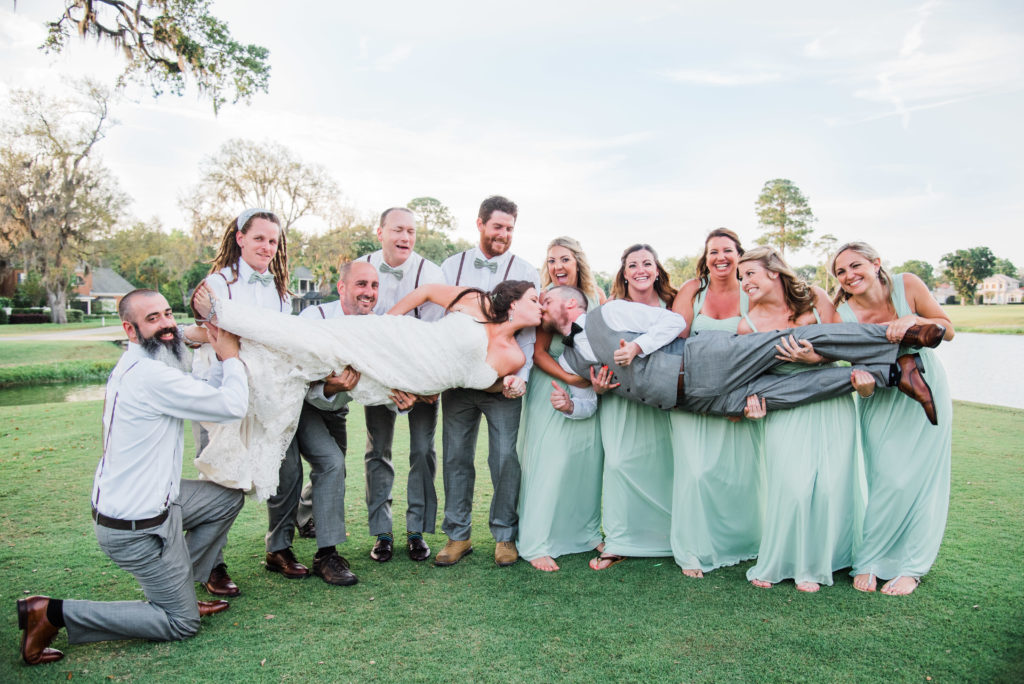 Bridal party photo on the lawn on the golf course at the  Queen's Harbour country club in Jacksonville Florida Photography by Chabeli Woolsey Black Tie & Co www.btcweddings.com