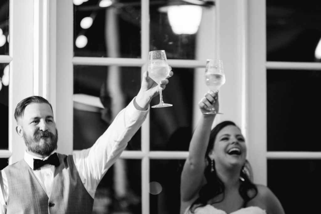 toasting during wedding reception Queen's Harbour country club in Jacksonville Florida Photography by Chabeli Woolsey Black Tie & Co www.btcweddings.com