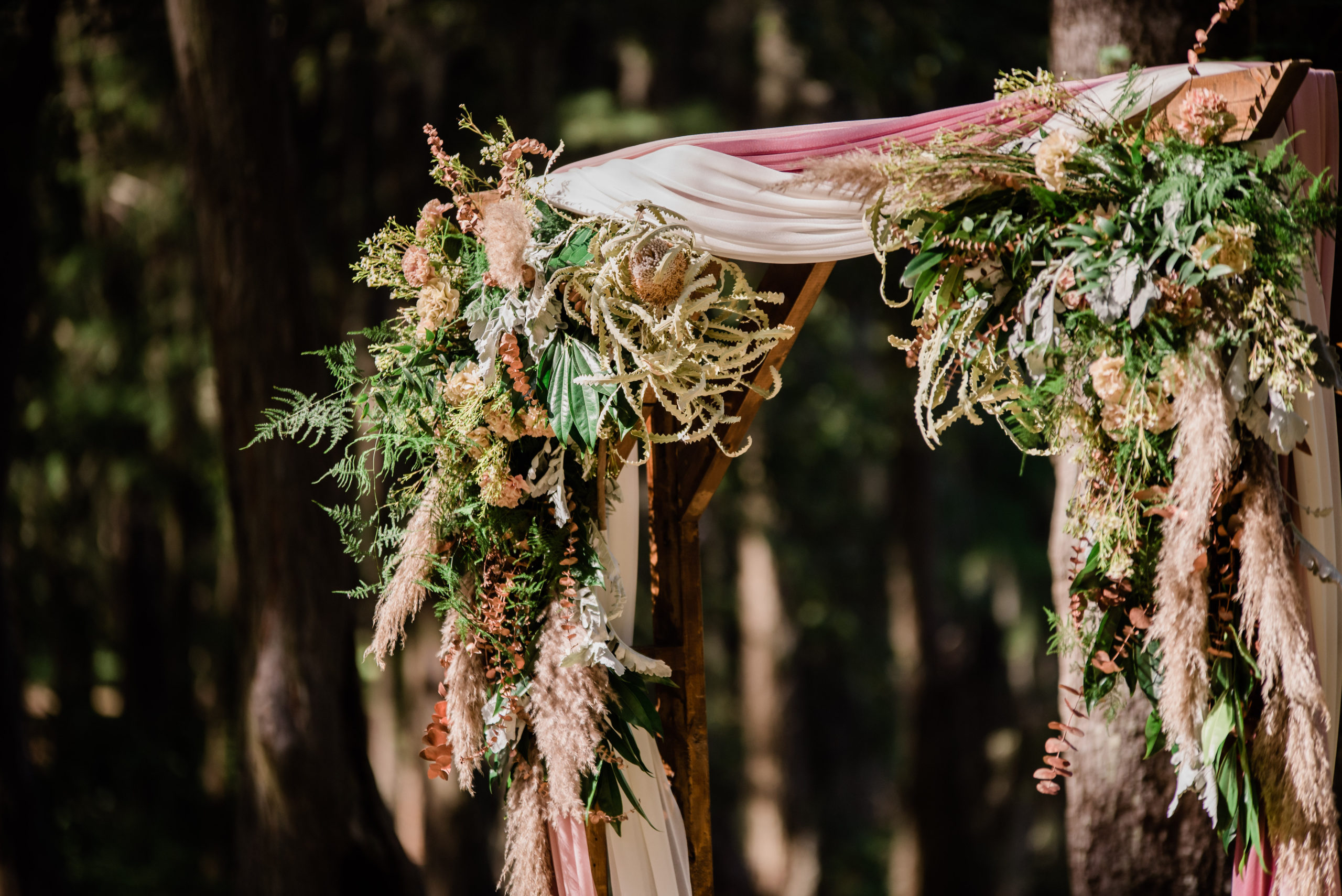 Ceremony floral arch Spirit of the Suwannee wedding photo by Black Tie & Co.